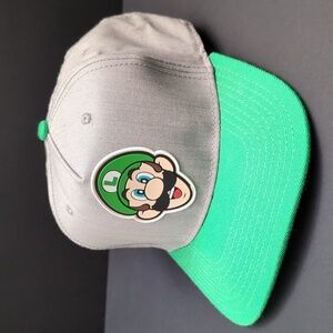 Nintendo Super Mario Luigi Gray/Green Snapback Hat.